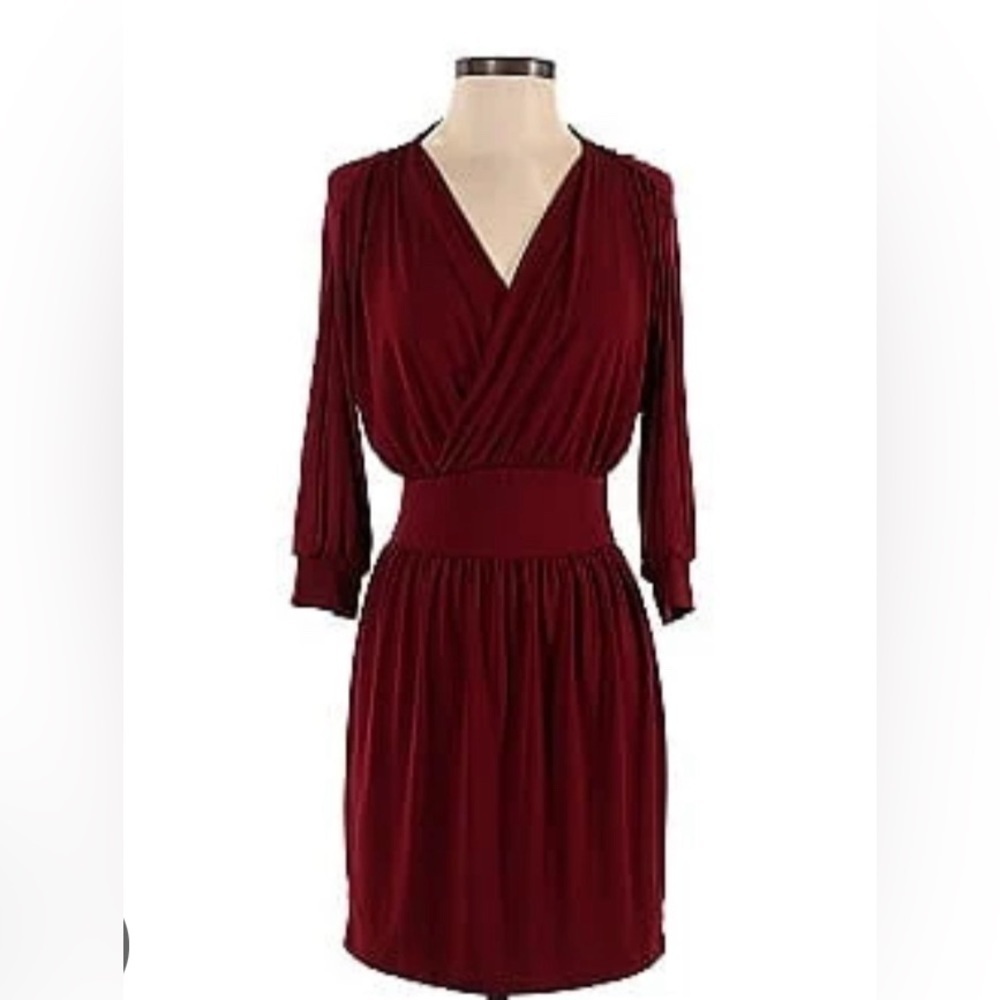 Moda dress in maroon. Poly blend with wrap detail and 3/4 sleeves.